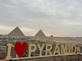 Separate hotel rooms with a view of the pyramids